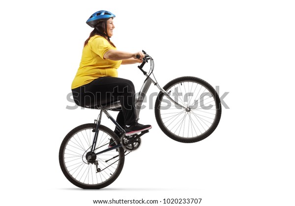 Overweight Woman Riding Bike Doing Wheelie Stock Photo 1020233707 ...