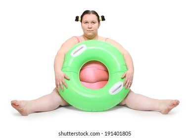 Overweight woman in swimmsuit with life buoy.