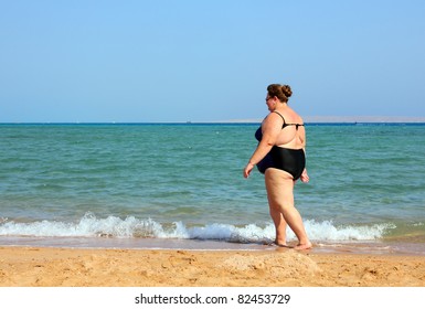 8 789 Fat People At The Beach Images Stock Photos Vectors Shutterstock   Overweight Woman Walking On Sea 260nw 82453729 