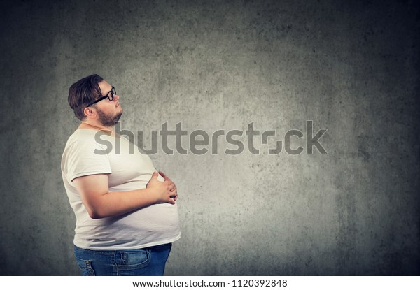 Overweight young man with big\
belly 