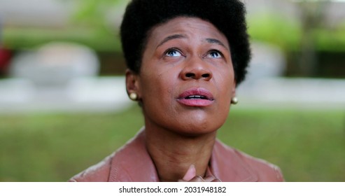 Overwhelmed African Woman Praying For Help. Suffering Black Girl Praying