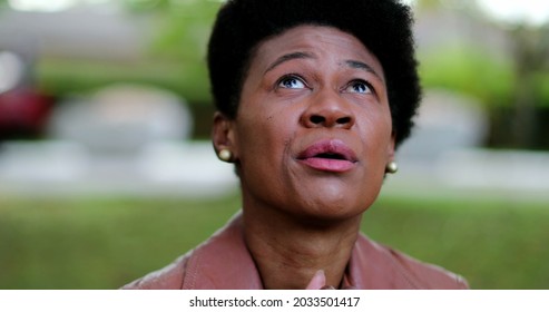 Overwhelmed African Woman Praying For Help. Suffering Black Girl Praying