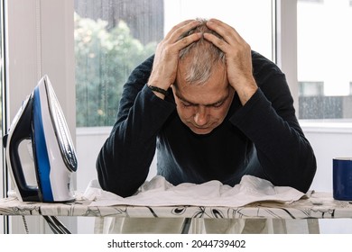 Overwhelmed Man Ironing. Concept Of Equality In Housework