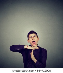 Overwhelmed Man Showing Time Out Hand Gesture, Frustrated Screaming To Stop Isolated On Grey Wall Background. Too Many Things To Do Concept 