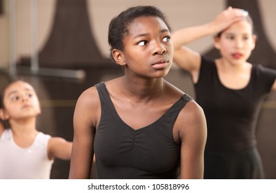 Overwhelmed young ballet students at dance class
