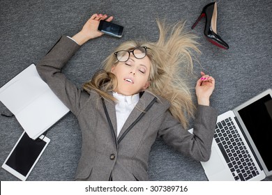 Overworked business woman - Shutterstock ID 307389716