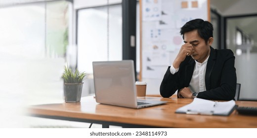 Overworked businessperson financier while working are stress the outcome - Shutterstock ID 2348114973