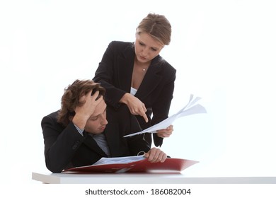 Overworked employee listening to his exigent leader - Shutterstock ID 186082004