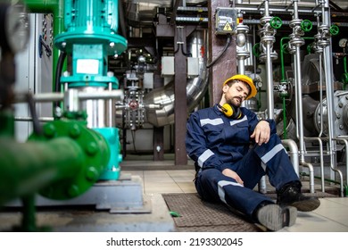 Overworked Employee Sleeping In Factory During Night Shift.