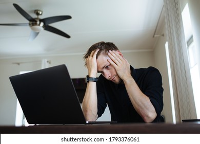 Overworked Freelancer In The Home Office, Worker At The Computer. Remote Video Team Meet Tired Man Frustrated Businessman Working Behind Laptop. Burnout As A Syndrome Linked To Chronic Work Stress