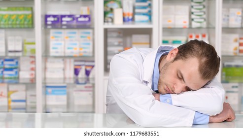 Overworked Pharmacist Specialist American Man Sleep on Table in Pharmacy Shop or Drugstore Interior, Pharmaceutical Store Concept