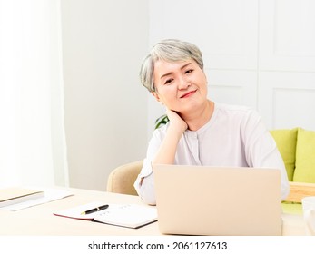 Overworked senior middle aged lady massaging neck feeling hurt pain. - Powered by Shutterstock