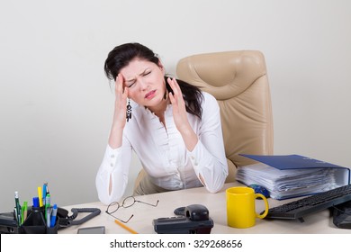 Overworked Woman With Pain In Office