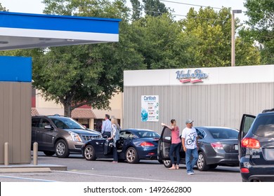 Oviedo, FL / USA - August 29, 2019: Residents Of Oviedo, Florida Get Out Of Their Cars While Waiting In Long Lines For Gas During Hurrican Dorian