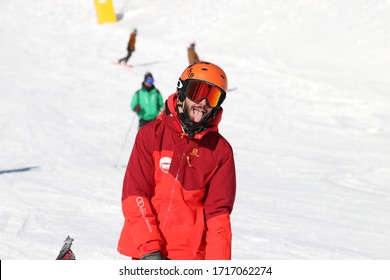 "Ovindoli, L'Aquila - December 10 2018 skier posing of SkiRed freeskier freestyle in the ski slope and beautiful winter  sunny day, Salomon Jacket, Oakley snowboard mask, people and snow background
