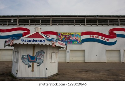 Owatonna, Minnesota, USA - September 6, 2020.  Grandstand At The Steele County Free Fair.  White Building With Ticket Booth And Colorful Painted Banner.  