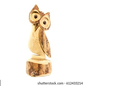 Owl carved on natural wood trunk isolated on white background - Powered by Shutterstock