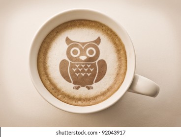 owl drawing latte art on coffee cup