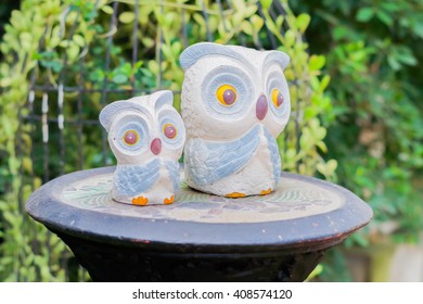 Owl statue on a natural background.