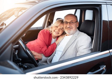 Own Car. Portrait Of Happy Senior Couple Sitting In Their New Automobile, Romantic Elderly Spouses Embracing And Looking Out Of Window, Celebrating Buying Vehicle In Dealership Store, Looking , - Powered by Shutterstock