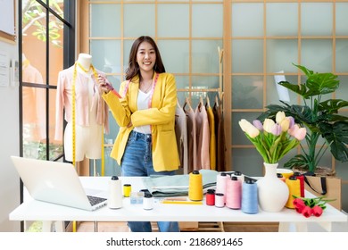 Owner Business Asian Young Women Fashion Designer Working On Her Designer In The Showroom,  Lifestyle Stylish Tailor Taking Measurements On Mannequin For Cutting Cloths In Studio.  Small Business