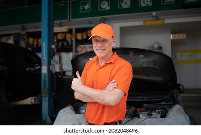 Owner Man Standing At Service Center, Car Repair, Tire Change. Mechanic Changing Engine, Service Car Workshop Automobile. Professional Man Shop Maintenance	