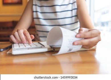 Owner Sitting On The Annual Tax Calculation Bracelets From Turnover To Reduce The Tax. Using As Background Business Concept And Finance Concept With Copy Space  For Your Text Or  Design.