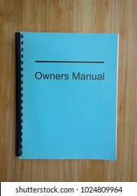 Owners Manual Binder On A Desk                               