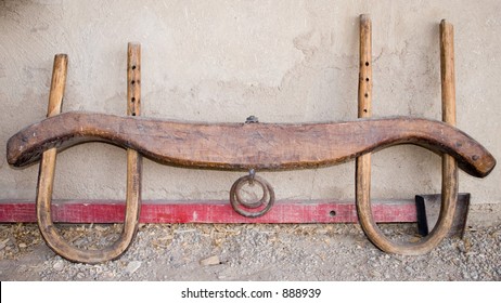 Oxen Yoke Against An Adobe Wall