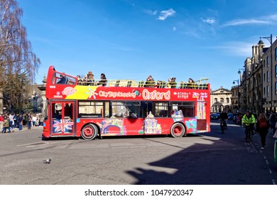 Oxford, Oxfordshire, UK - March 25, 2017: An Oxford City, Open-Topped, Hop On Hop Off, Site Seeing Tour Bus In Broad Street, Oxford, England                     