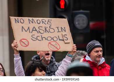 OXFORD STREET, LONDON, ENGLAND- 20 March 2021: Protester Holding A 'NO MORE MASKS IN SCHOOLS' Placard At The Vigil For The Voiceless Anti-lockdown Protest In London