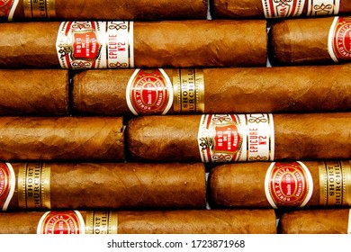 Oxford, UK 04/29/2020: Cuban Cigar Background. Hoy de Monterrey and Romeo y Julieta cigars. Traditional hand rolled tobacco products. Symbol of luxury lifestyle.