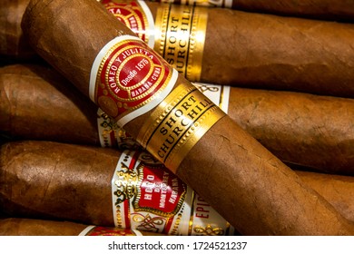 Oxford, UK 04/29/2020: Cuban Cigar Background. Hoyo de Monterrey and Romeo y Julieta cigars. Traditional hand rolled tobacco products. Symbol of luxury lifestyle.