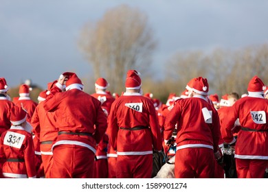 Oxfordshire, UK - December 14th 2019: People Dressed As Father Christmas Take Part In The Annual Santa Fun Run.