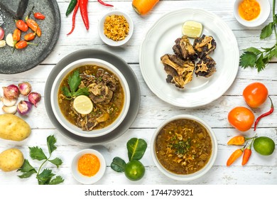 Oxtail Soup And Fried Oxtail Are Served On The Table Side By Side With The Basic Spices.