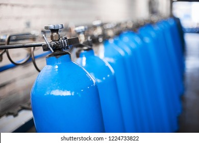 Oxygen Cylinder With Compressed Gas. Blue Oxygen Tanks For Industry. Liquefied Oxygen Production. Factory