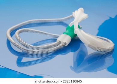 Oxygen delivery with nasal oxygen cannula for neonates in need of increased airflow placed on turquoise background