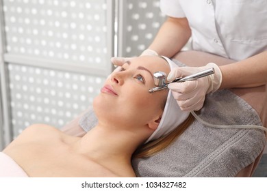 Oxygen Infusion. A Woman In A Beauty Salon During A Care Treatment Using Active Oxygen