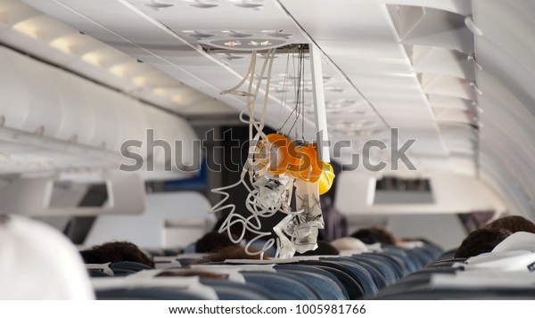Oxygen Mask falling out in\
Airplane.