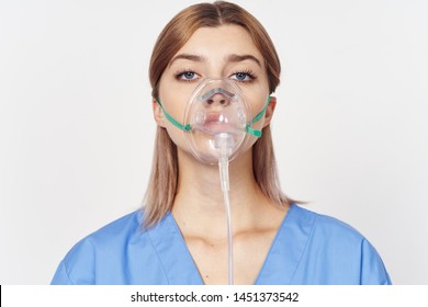 Oxygen mask on the face of the doctor in a medical gown - Powered by Shutterstock