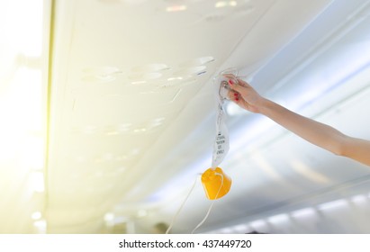 An Oxygen Mask On The Plane.selective Focus, Soft Focus .hands,selective Focus.