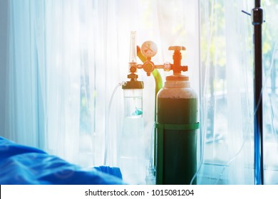 Oxygen Tank Beside Patient Bed In Hospital.