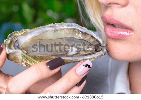 Oyster in hands