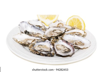 Oyster And Lemon On White Background On White Plate