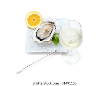 Oyster on ice and with a piece of lemon and wine.