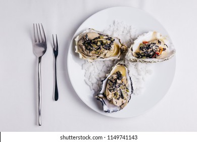 Oyster Rockefeller And Sake-poached Oyster, Cooked In Hijki Butter And Black Seaweed.