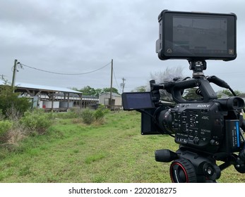 Oyster, Virginia US - May 26, 2022: 4k Cinema Camera With Matte Box And Monitor Set Up On A Tripod Facing Towards A Building