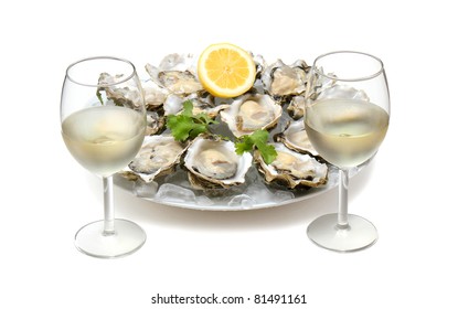 Oysters on ice and with a piece of lemon and wine.