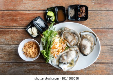 Oysters,Spicy Oyster Salad,Yum, Oyster and side dishes in Thai style with spicy dipping sauce.