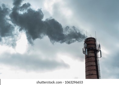 ozone depletion, chemical threat, pollution of nature and air.  old pipe of the boiler room. ejection into the air of smoke. - Shutterstock ID 1063296653